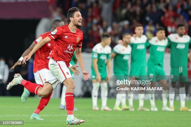 Ahly players celebrate winning the penalty shootout during the CAF Super Cup football match between Egypt's Al-Ahly and Morocco's Raja Club Athletic...