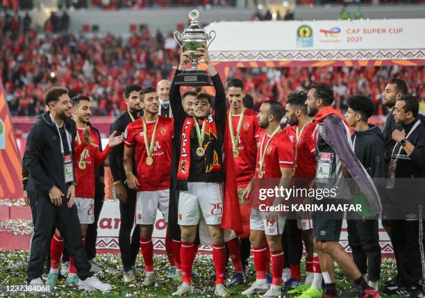 Ahly players celebrate winning the CAF Super Cup football match between Egypt's Al-Ahly and Morocco's Raja Club Athletic at the Ahmad Bin Ali Stadium...