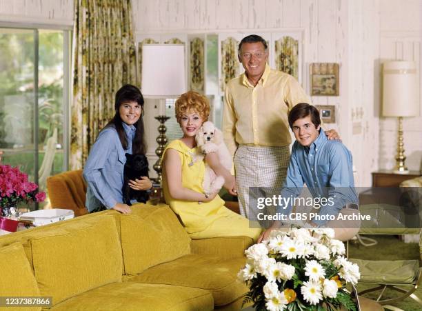 Portrait of Lucille Ball and her family. From left is Lucie Arnaz, Lucille Ball, Gary Morton, Desi Arnaz, Jr.