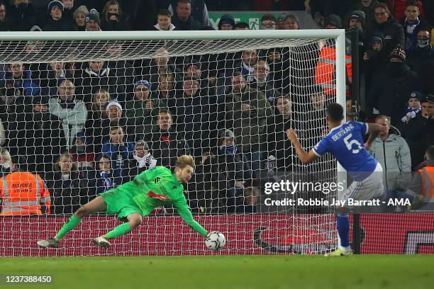 Caoimhin Kelleher of Liverpool saves a penalty from Ryan Bertrand of Leicester City during the Carabao Cup Quarter Final match between Liverpool and...