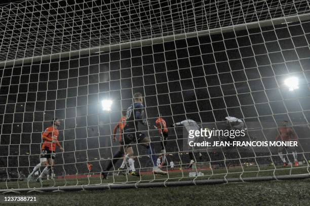 Paris Saint-Germain's Argentinian forward Mauro Icardi heads the ball to score a goal during the French L1 football match between FC Lorient and...
