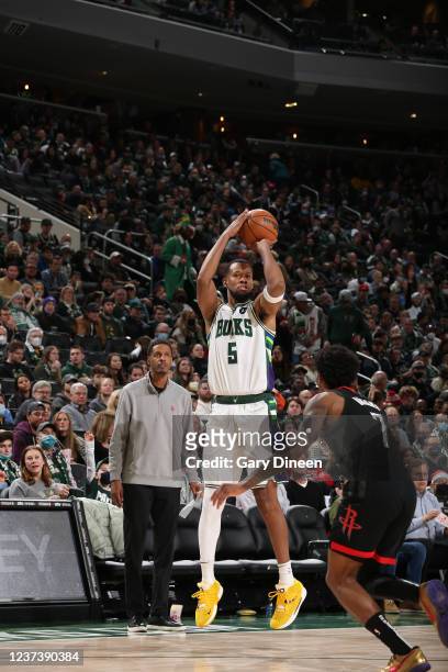 Rodney Hood of the Milwaukee Bucks shoots against Armoni Brooks of the Houston Rockets during the NBA game at Fiserv Forum on December 22, 2021 in...