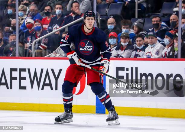 Logan Stanley of the Winnipeg Jets keeps an eye on the play during third period action against the Washington Capitals at Canada Life Centre on...