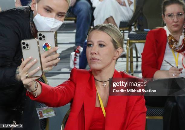 Russian journalist and former candidate for Presidential Elections Ksenia Sobchak takes a selfie photo during Vladimir Putin's annual press...