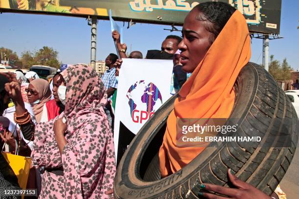 Sudanese women take part in a protest decrying sexual attacks, after the UN said at least 13 women and girls were raped in the recent mass protests...