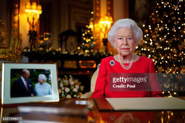 Queen Elizabeth II records her annual Christmas broadcast in the White Drawing Room at Windsor Castle on December 23, 2021 in Windsor, England. The...