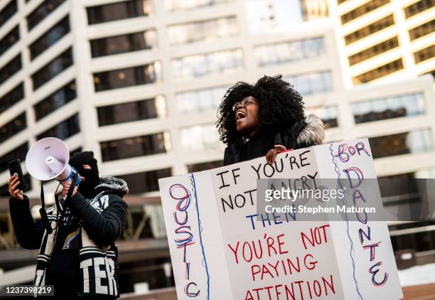 People demonstrate in support of the family of Daunte Wright outside the Hennepin County Government Center on December 23, 2021 in Minneapolis,...