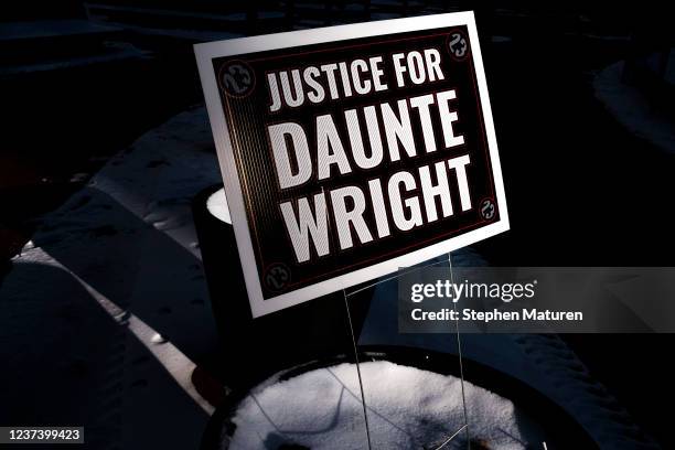 Sign reading Justice for Daunte Wright is placed outside the Hennepin County Government Center on December 23, 2021 in Minneapolis, Minnesota. Jury...