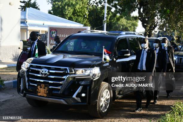 Nigerian President Muhammadu Buhari arrives to address troops at the airforce base in Maiduguri on December 23, 2021. - At least four people were...