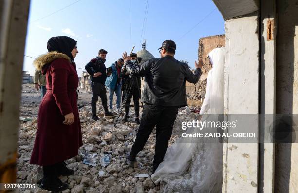 Students of a film school, prepare to shoot a scene, in the war-ravaged northern Iraqi city of Mosul, on December 15, 2021. - In a collaboration...