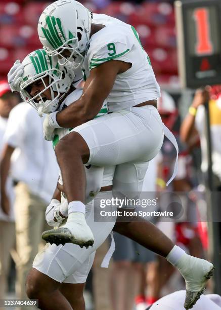 North Texas Mean Green defensive end Grayson Murphy celebrates with defensive lineman Gabriel Murphy after a sack during the Frisco Football Classic...