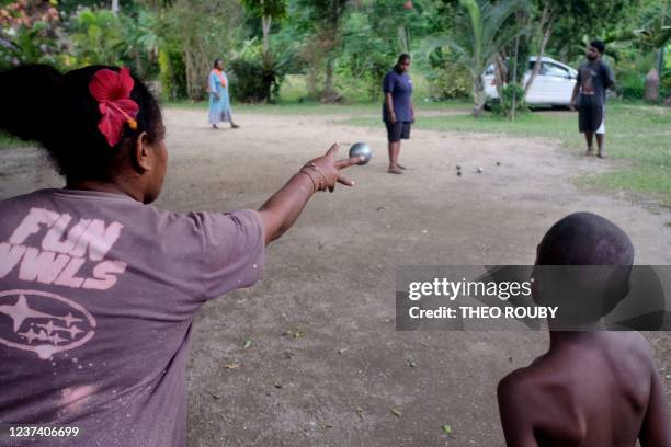 People of the Ina tribe play petanque on the occasion of a family reunion, and a mourning ceremony, in Hienghene, on the eastern coast of New...