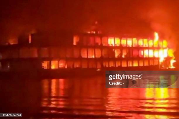 This frame grab from an AFPTV video shows a burning ferry after it caught on fire killing at least 37 people in Jhalkathi, 250 kilometers south of...