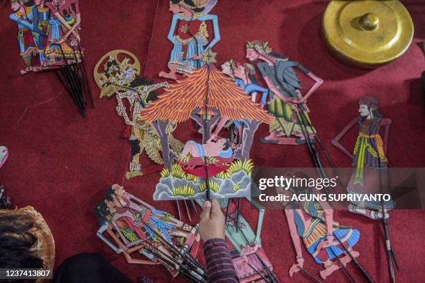 This photo taken on December 24, 2021 shows Christmas-themed puppetry in Bantul, Yogyakarta. - A small community in Indonesia is celebrating...