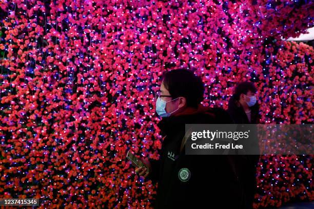 People visit a Christmas market at HuaXi Live shopping mall on Christmas day on December 25, 2021 in Beijing, China.