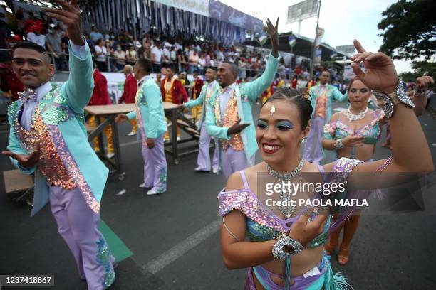 Revellers perform during the 'Salsodromo', the kick-off of the music and cultural festival Feria de Cali in Cali, Colombia, on December 25, 2021. -...