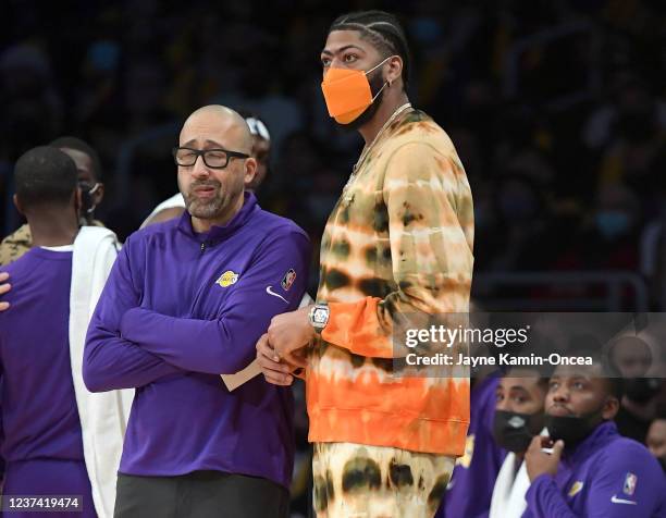 Anthony Davis and assistant head coach David Fizdale of the Los Angeles Lakers talk in the second half of the game against the Brooklyn Nets at...