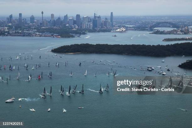 Yachts sail during the 2021 Sydney to Hobart race start on Sydney Harbour on December 26, 2021 in Sydney, Australia.