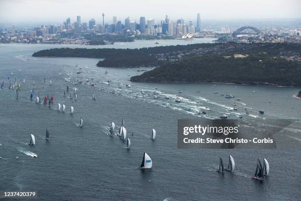 Yachts sail during the 2021 Sydney to Hobart race start on Sydney Harbour on December 26, 2021 in Sydney, Australia.