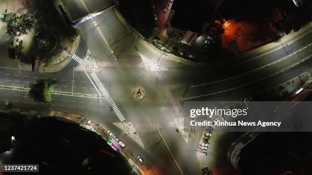 Aerial photo taken on Dec. 25, 2021 shows a view of deserted roads during the night curfew in Bhopal, the capital city of India's Madhya Pradesh...