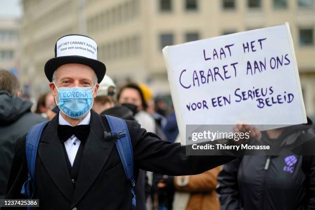 Cabaret artist Karel Declercq shows a panel where it is written: ' Laat het cabaret aan ons voor een serieus beleid' while he demonstrates in the...