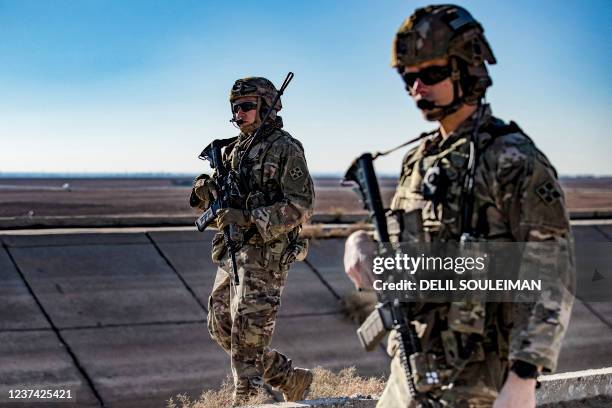 Soldiers patrol along the frontlines between areas held by the Syrian Democratic Forces and Turkish-backed fighters near the village of Dardara in...