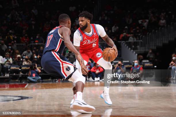 Myles Powell of the Philadelphia 76ers dribbles the ball during the game against the Washington Wizards on December 26, 2021 at Capital One Arena in...