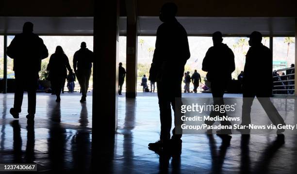 Arcadia, CA Horse racing fans are silhouetted as they walk through the grand stands during Opening day of the winter-spring meet at Santa Anita Park...