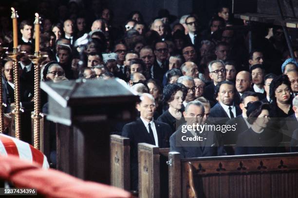 President Lyndon Johnson and his wife sit in the front row of St Patrick's Cathedral during the funeral of Senator Robert F. Kennedy in New York City...