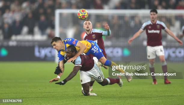 Southampton's Jan Bednarek challenges West Ham United's Michail Antonio during the Premier League match between West Ham United and Southampton at...