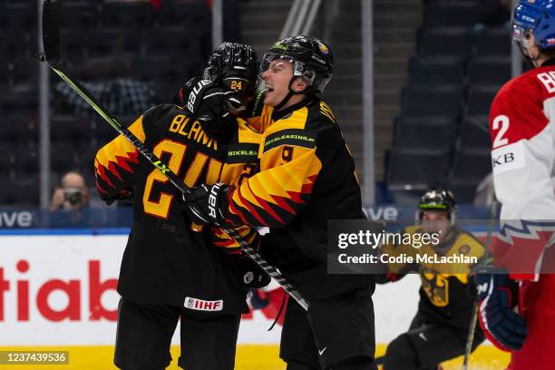 Alexander Blank and Justin Volek of Germany celebrate a goal against Czechia in the second period during the 2022 IIHF World Junior Championship at...