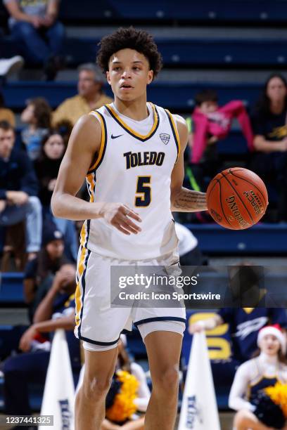 Toledo Rockets guard Ryan Rollins brings the ball up court during a college basketball game against the Marshall Thundering Herd on Dec. 21, 2021 at...