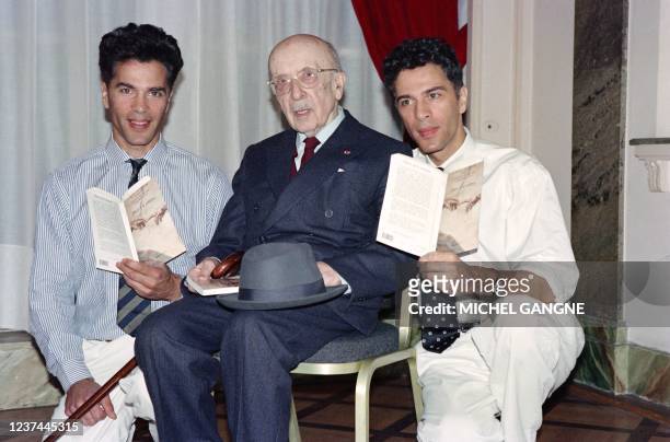 French writer and acamedician Jean Guitton is surrounded by French scientific journalists Igor and Grichka Bogdanoff with whom he wrote "Dieu et la...
