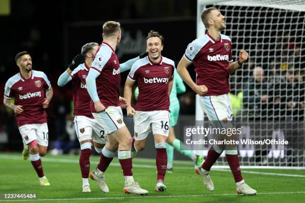 Mark Noble of West Ham celebrates scoring their 3rd goal from the penalty spot during the Premier League match between Watford and West Ham United at...