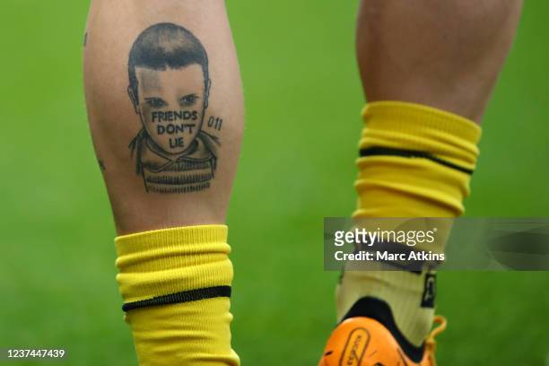 The tattood leg of Jaraj Kucka of Watford during the Premier League match between Watford and West Ham United at Vicarage Road on December 28, 2021...