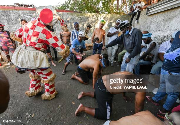 An Ireme, a masked dance of the men's religious secret society known as Abakua , dances during the oath ceremony of the Efi Barondi Cama "potency" in...