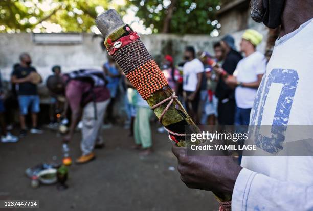 Member of the men's religious secret society known as Abakua holds a cane during a ceremony of the Efi Barondi Cama "potency" in Simpson...