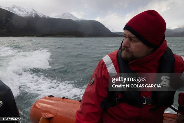 Marine biologist Rodrigo Hucke follows a humpback whale at the Beagle Channel in Chile, on November 29, 2021. - From the waters of one of the most...