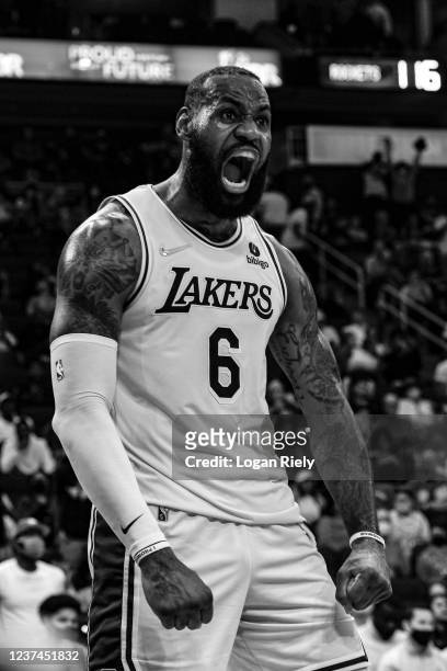LeBron James of the Los Angeles Lakers celebrates a dunk during the game against the Houston Rockets on December 28, 2021 at the Toyota Center in...
