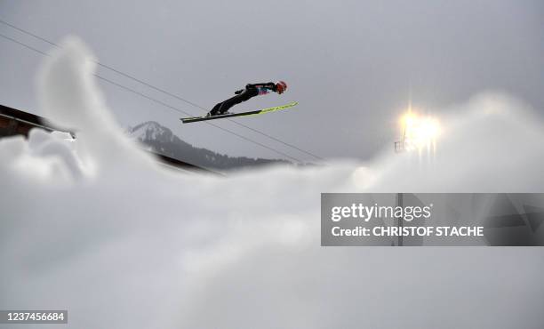 Germany's Markus Eisenbichler soars through the air during the trial round of the Four-Hills Ski Jumping tournament , in Oberstdorf, southern...