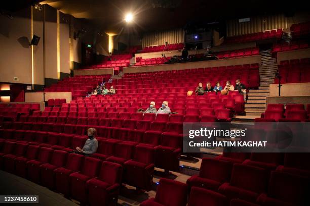 People take a seat for the 'Demain c'etait mieux, non peut-etre' show at the Centre Culturel venue in Auderghem - Oudergem, in Brussels, on December...