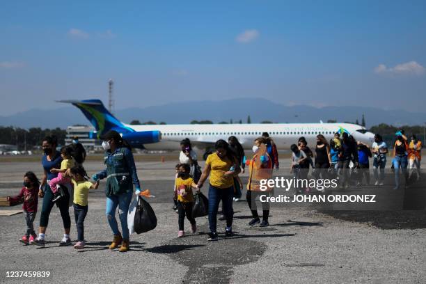 Guatemalan migrants deported from the US arrive to the Air Force Base in Guatemala City, on December 29, 2021. - The United States deported 17,806...