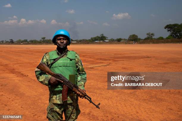 United Nations peacekeeper waits for a helicopter, operated by United Nations Multidimensional Integrated Stabilization Mission in Central African...