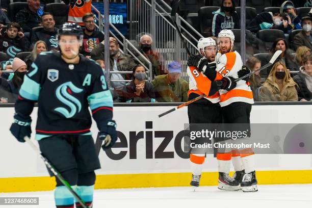 Ivan Provorov celebrates with Kevin Hayes of the Philadelphia Flyers after scoring the game-winning overtime goal to defeat the Seattle Kraken by a...