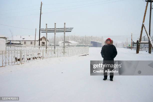 Man wears thick clothes as temperature dropped to 60 Celsius degrees below 0 in Russia's Oymyakon province on December 24, 2021.