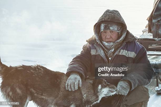 Man wears thick clothes as temperature dropped to 60 Celsius degrees below 0 in Russia's Oymyakon province on December 24, 2021.
