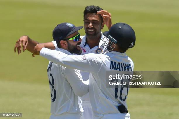 India's Virat Kohli celebrates with India's Mayank Agarwal after India won the first Test cricket match between South Africa and India at SuperSport...