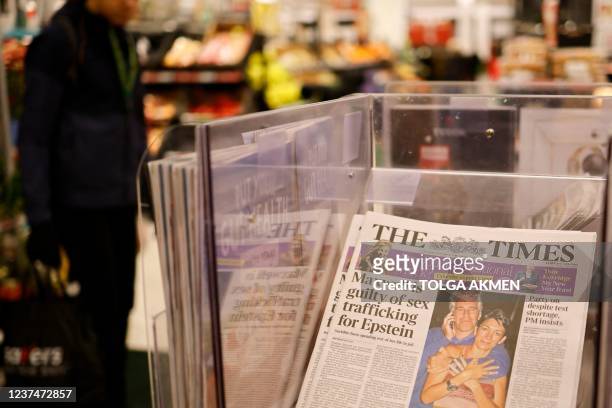 Headline from The Times newspaper is pictured in a store in London on December 30 the morning after a jury in New York found Ghislaine Maxwell guilty...