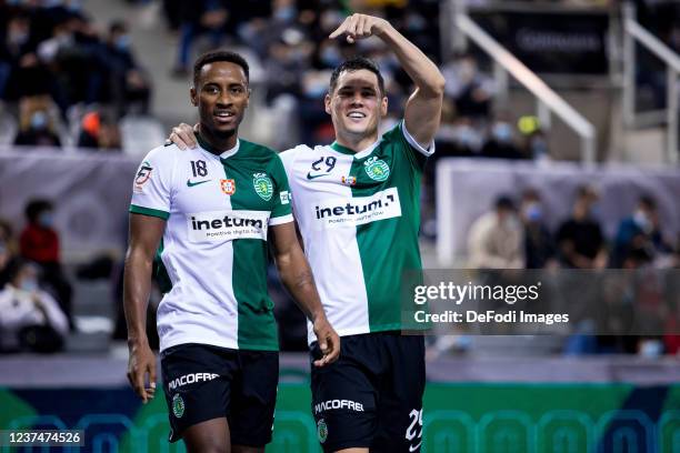 Lisbon, Portugal, : Anilton Varela "Pany" and Alex Merlim celebrate after scoring during the Futsal Super Cup match between Sporting CP v SL Benfica...