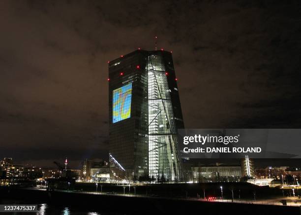 The tower of the European Central Bank main building is pictured by night showing showing the number "20" in Frankfurt/Main, western Germany, on...